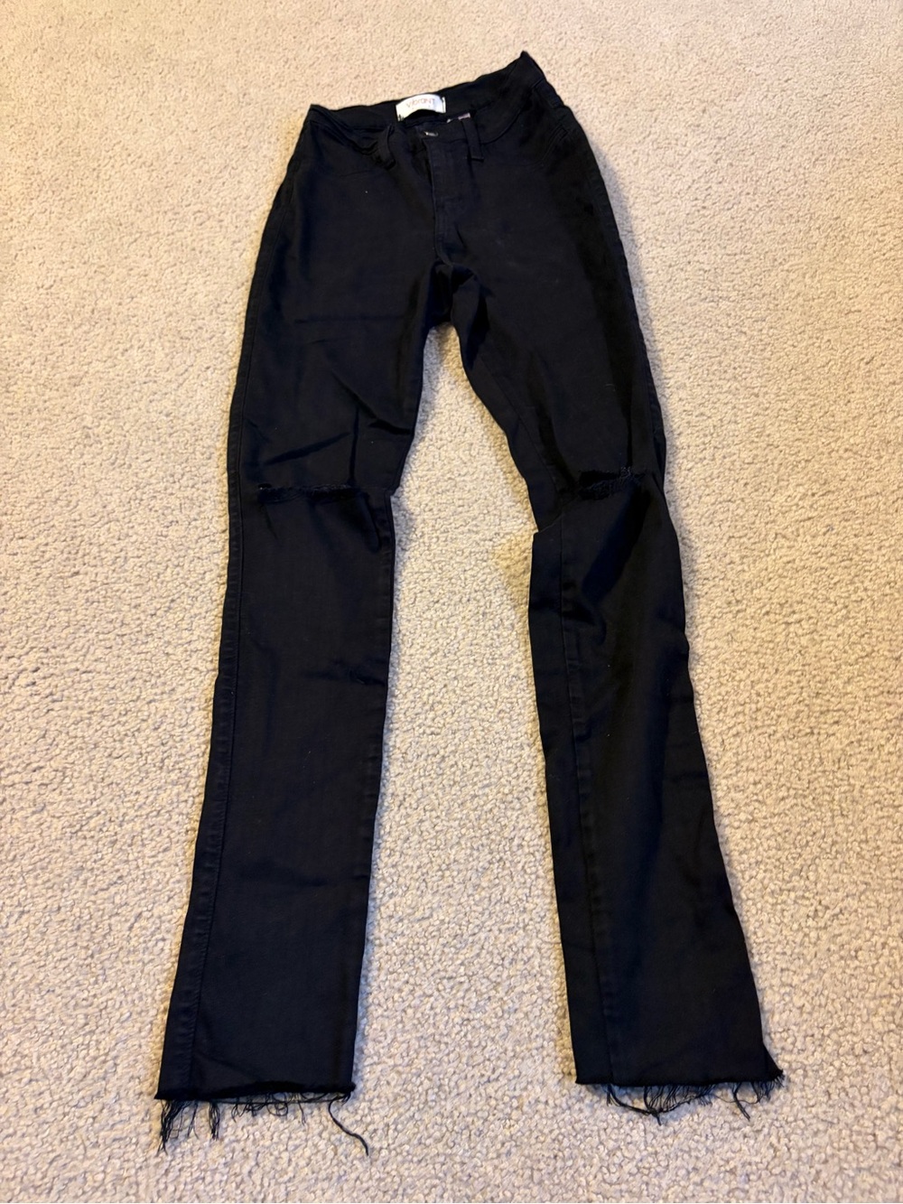 Vibrant Black Flare Jeans with Distressed Knees